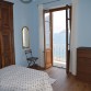 Schlafzimmer mit Doppelbett mit Seeblick und Ausgang zum Balkon mit Seesicht