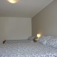1.Schlafzimmer mit Doppelbett und Einzelbett und Ausgang zum Balkon mit Seesicht
