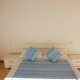 Schlafzimmer mit Doppelbett, Sideoboard, Spiegel, grosser Schrank